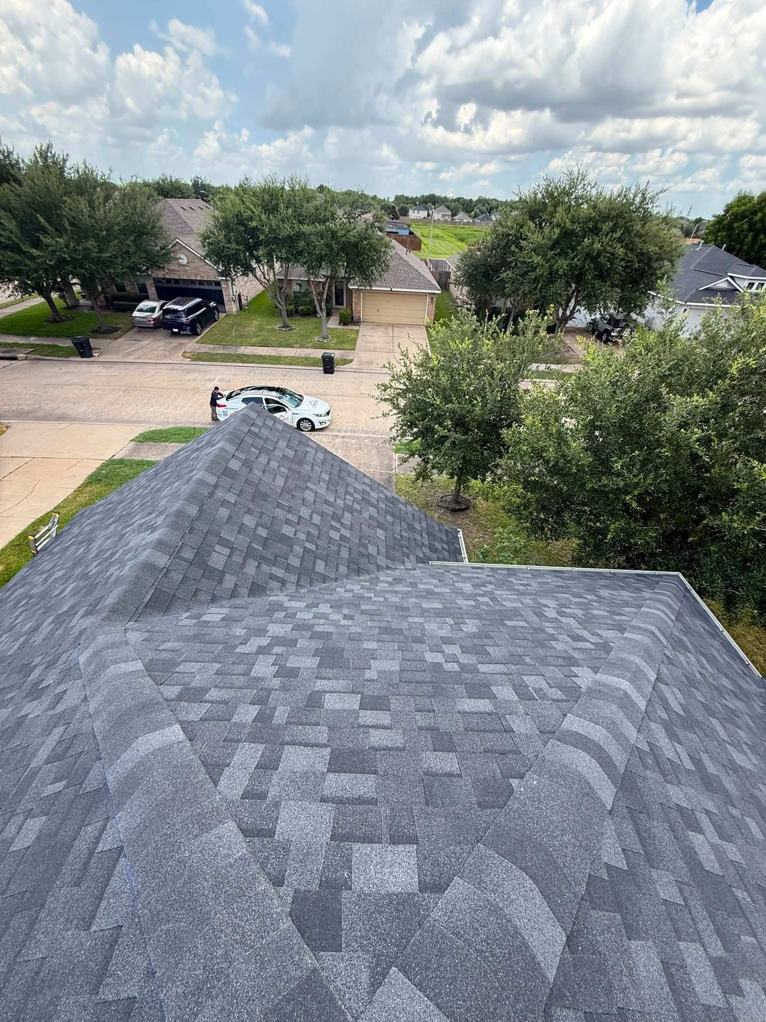 Aerial view of a completed roof in a Houston neighborhood