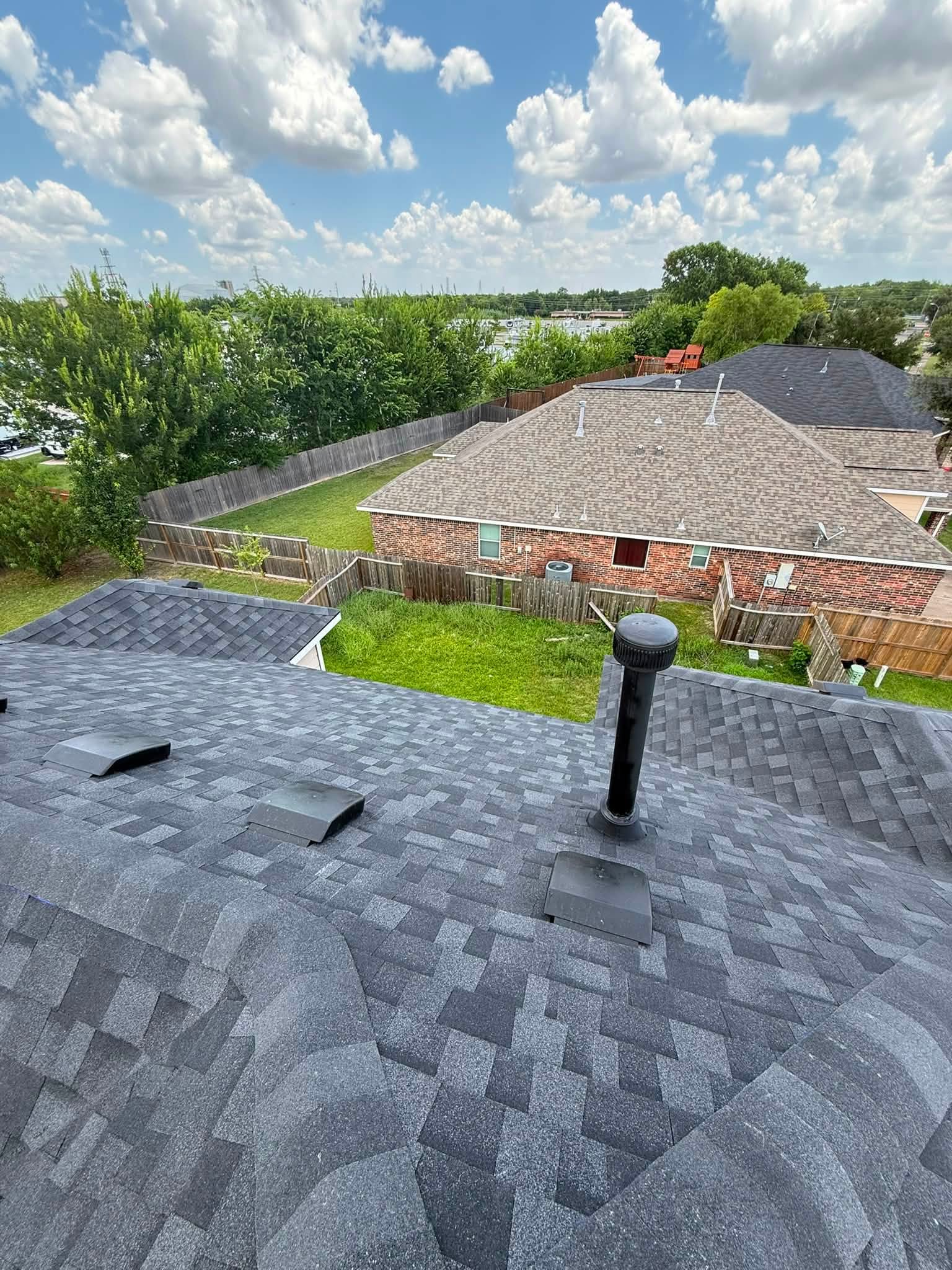 Finished roof showing clean vent boot and flashing work